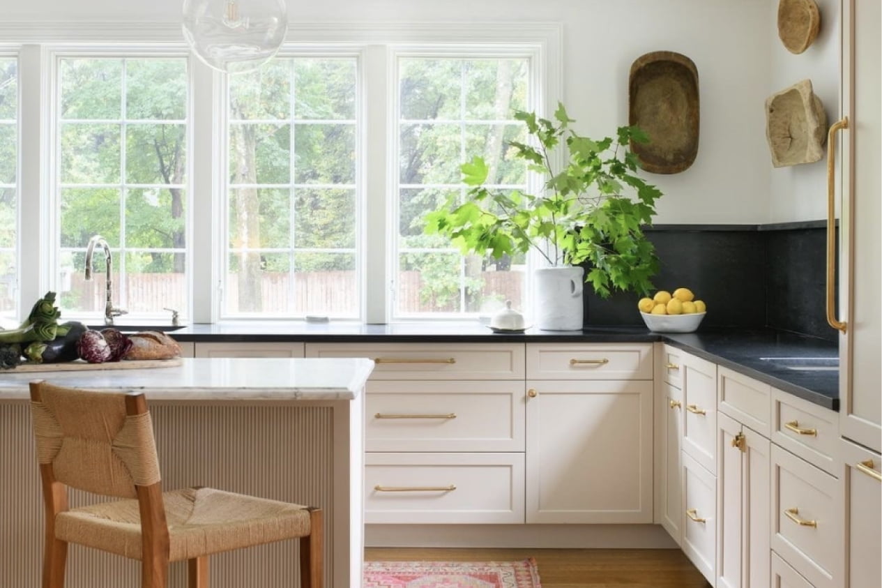 White casement windows bringing natural light into a bright kitchen